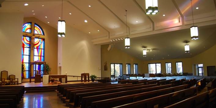 Classic pendant lighting installed in a church sanctuary