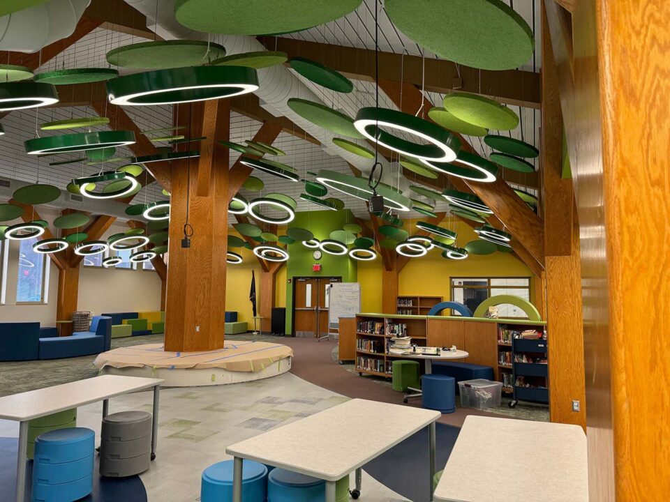 Playful green ring lighting installed in an elementary school library